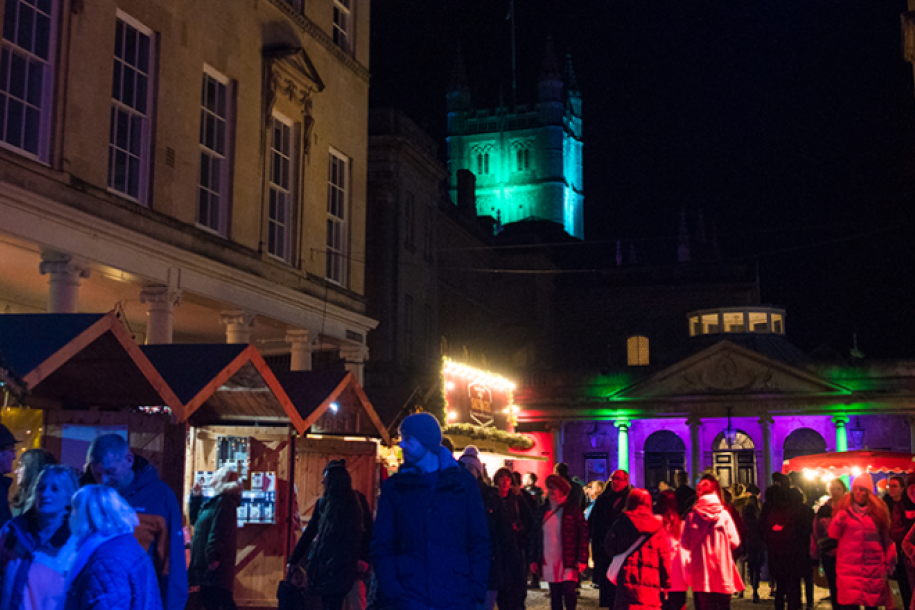 Row of chalets under the twinkling lights of Bath Christmas Market