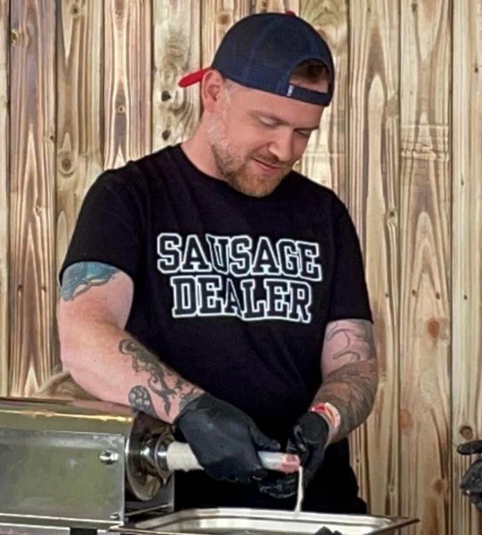 Sosij owner making fresh sausages.
