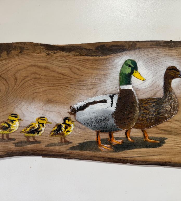 Engraved image of ducks.