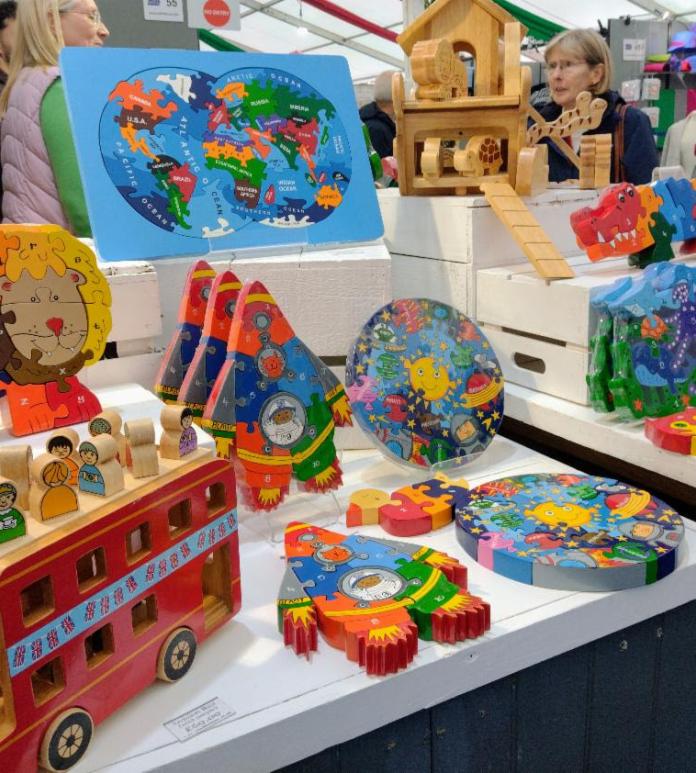 Stand with different types of toys and puzzles.