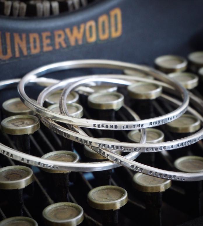 Silver bangles with quotes engraved