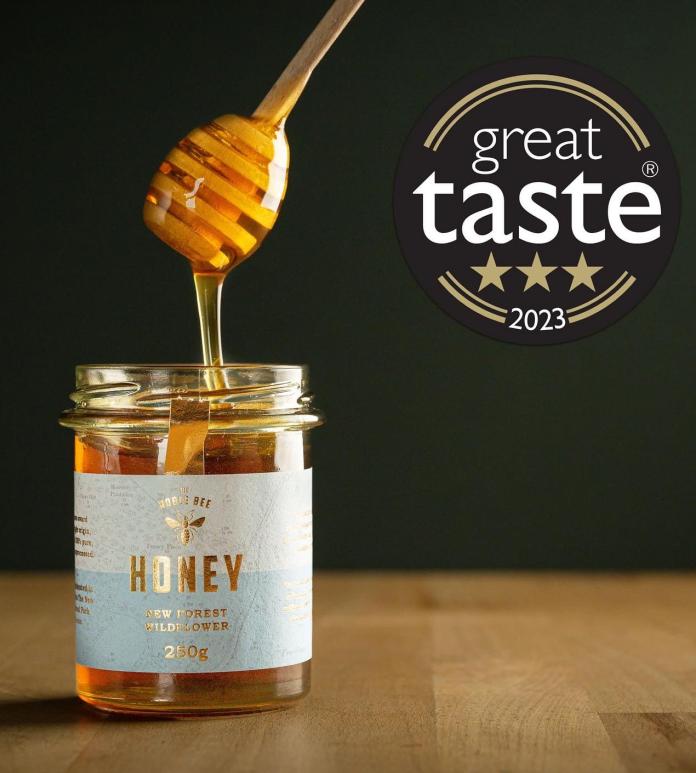 Honey dripping into jar