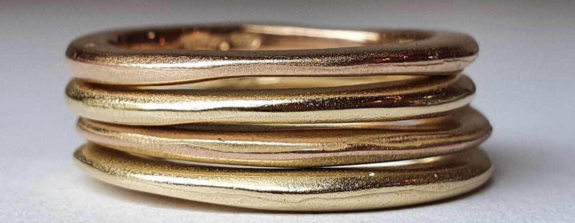 A stack of gold bracelets