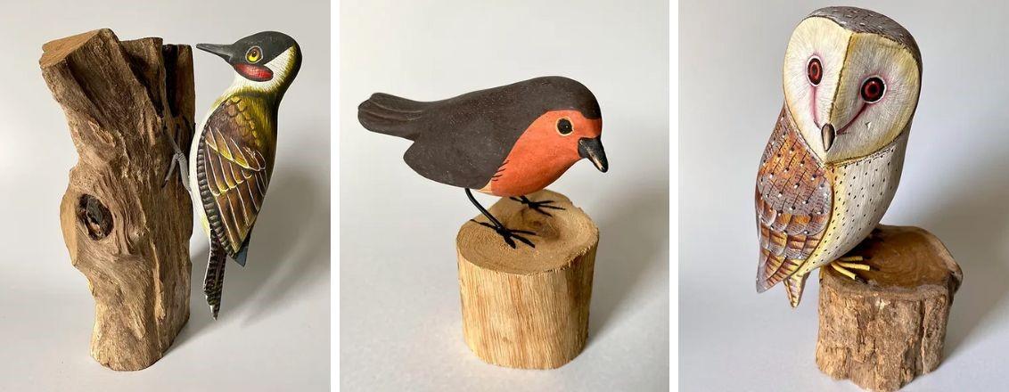 A wooden carving of a Woodpecker, a Robin and an Owl