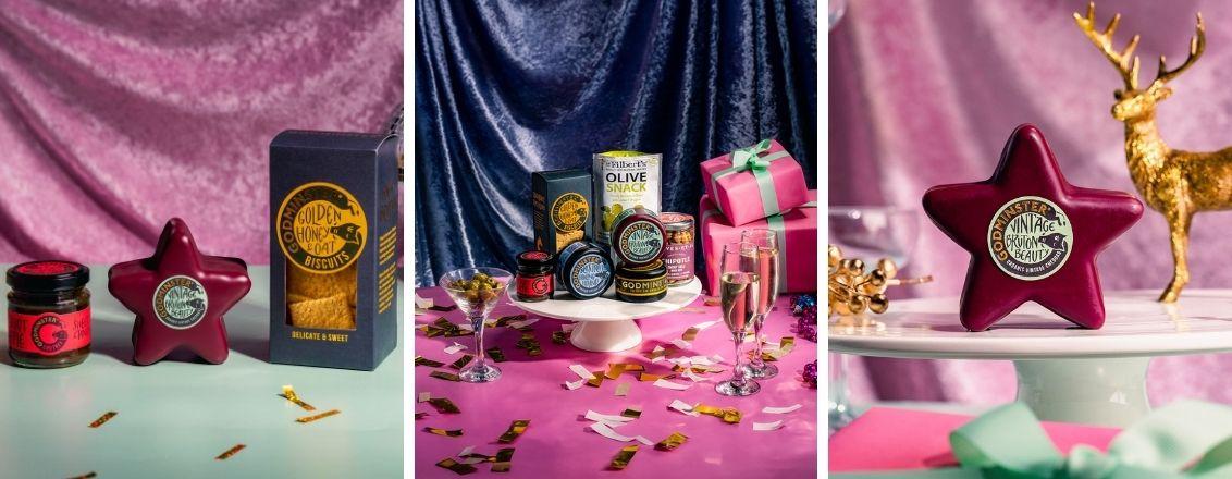 An arrangement of cheese and crackers photographed against a pink background.